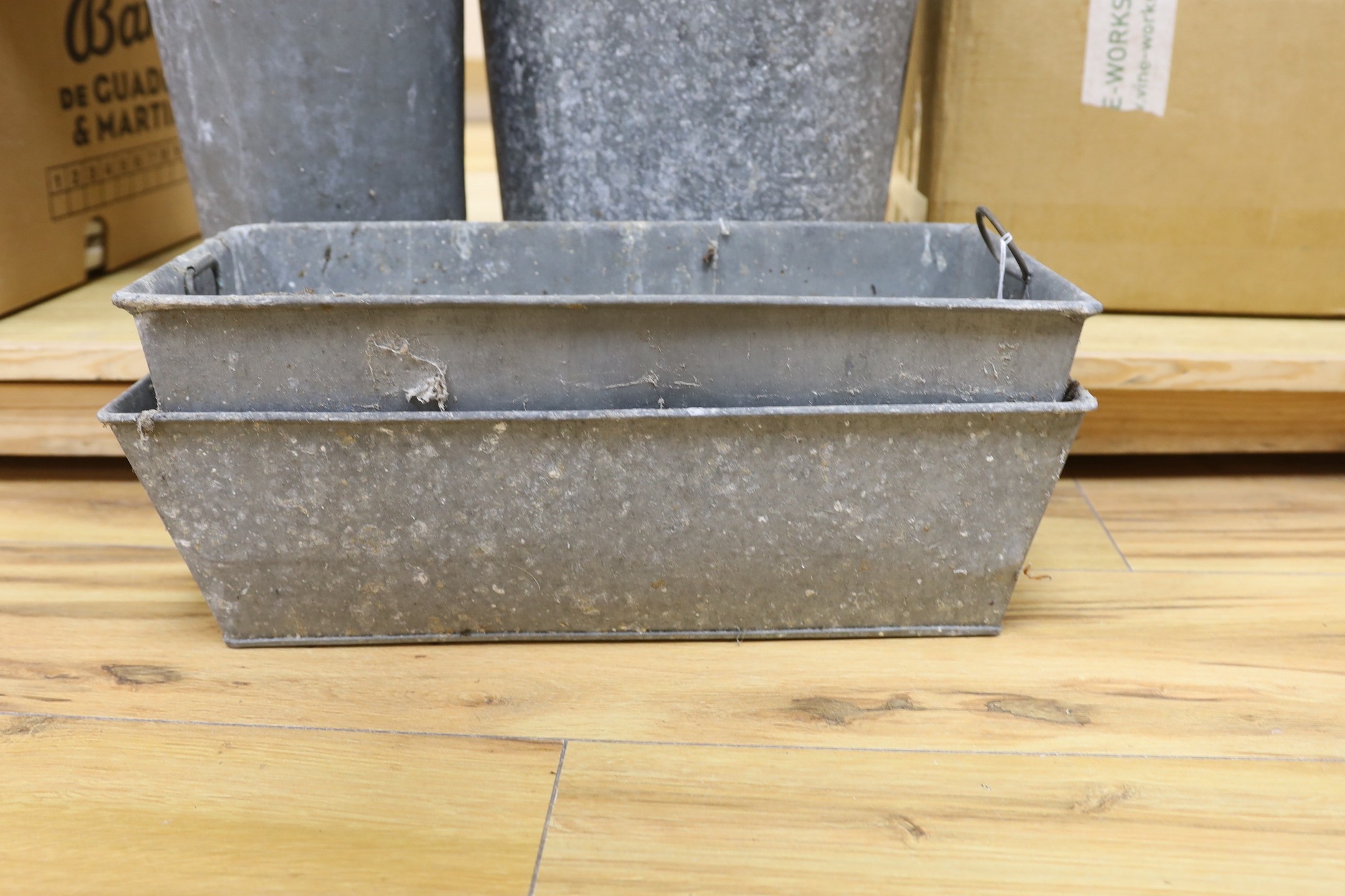 A mixed collection of galvanised troughs and wares